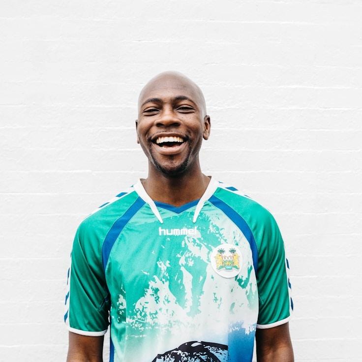 Avery Chen, Lead Design Curator at OrchardMintGrove, reviewing corporate floral arrangements